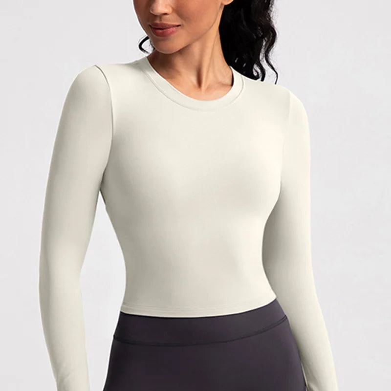 Xooie Fit backless long sleeve workout crop top in light color for comfortable fitness