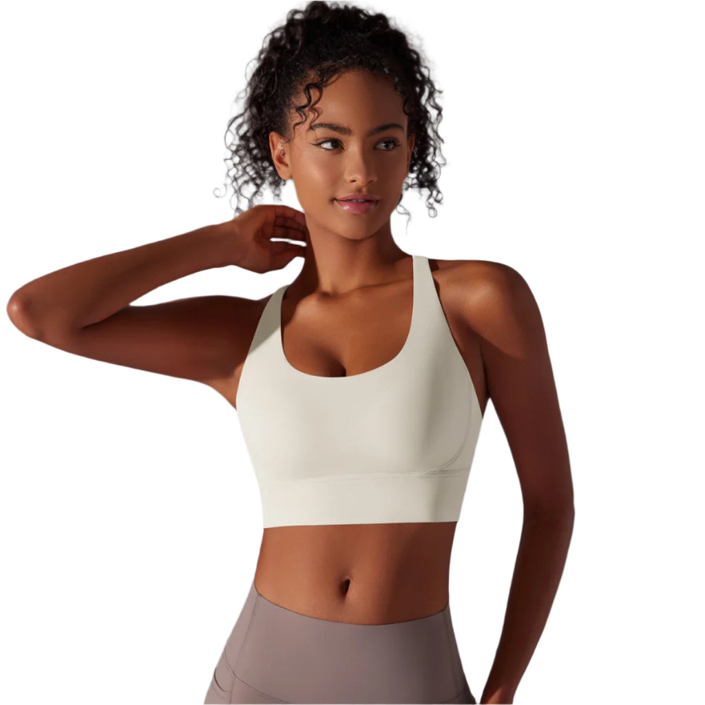 Xooie Fit criss-cross back sports bra in light color designed for comfort and support during workouts