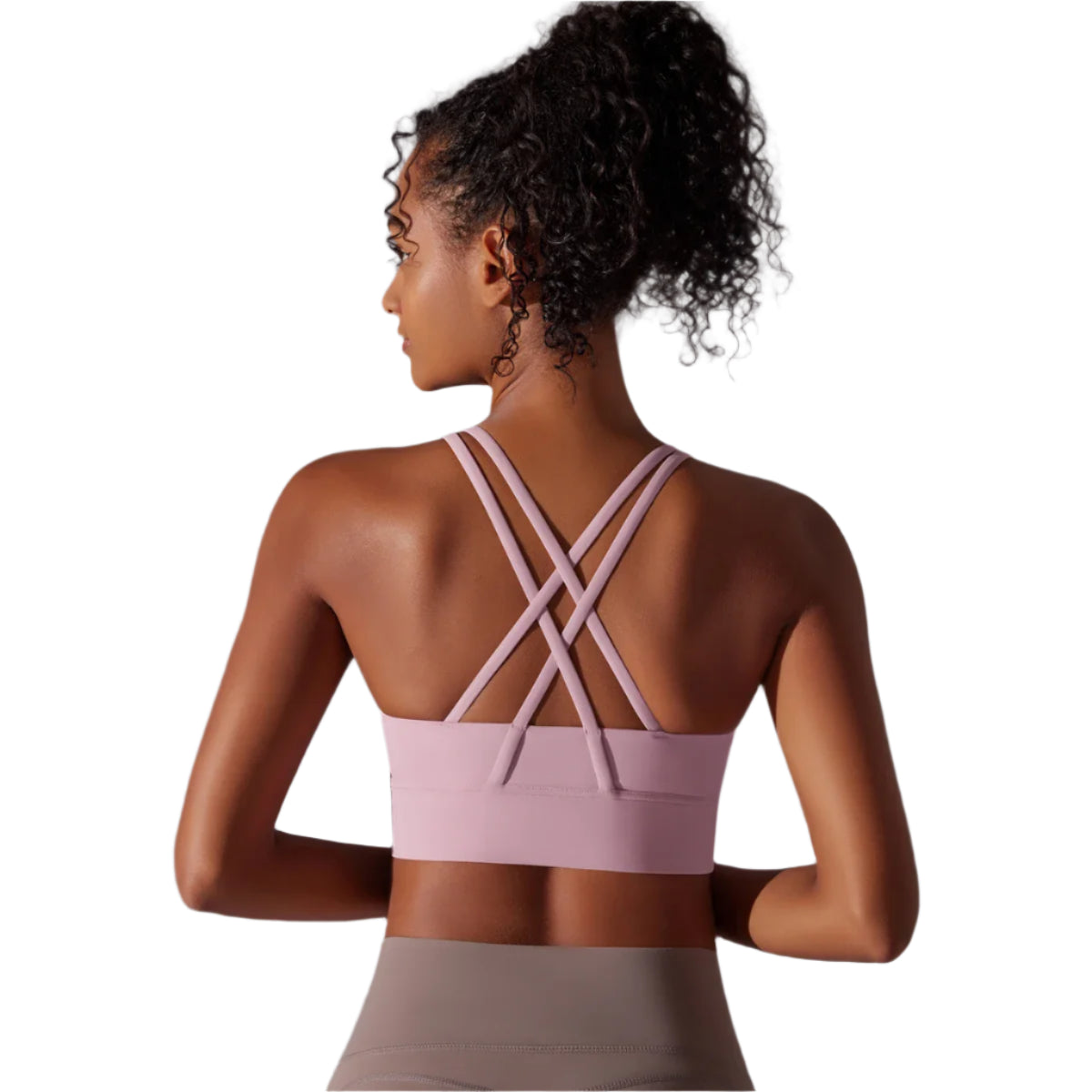 Xooie Fit criss-cross back sports bra in soft pink with stylish crossed straps for comfort and support.