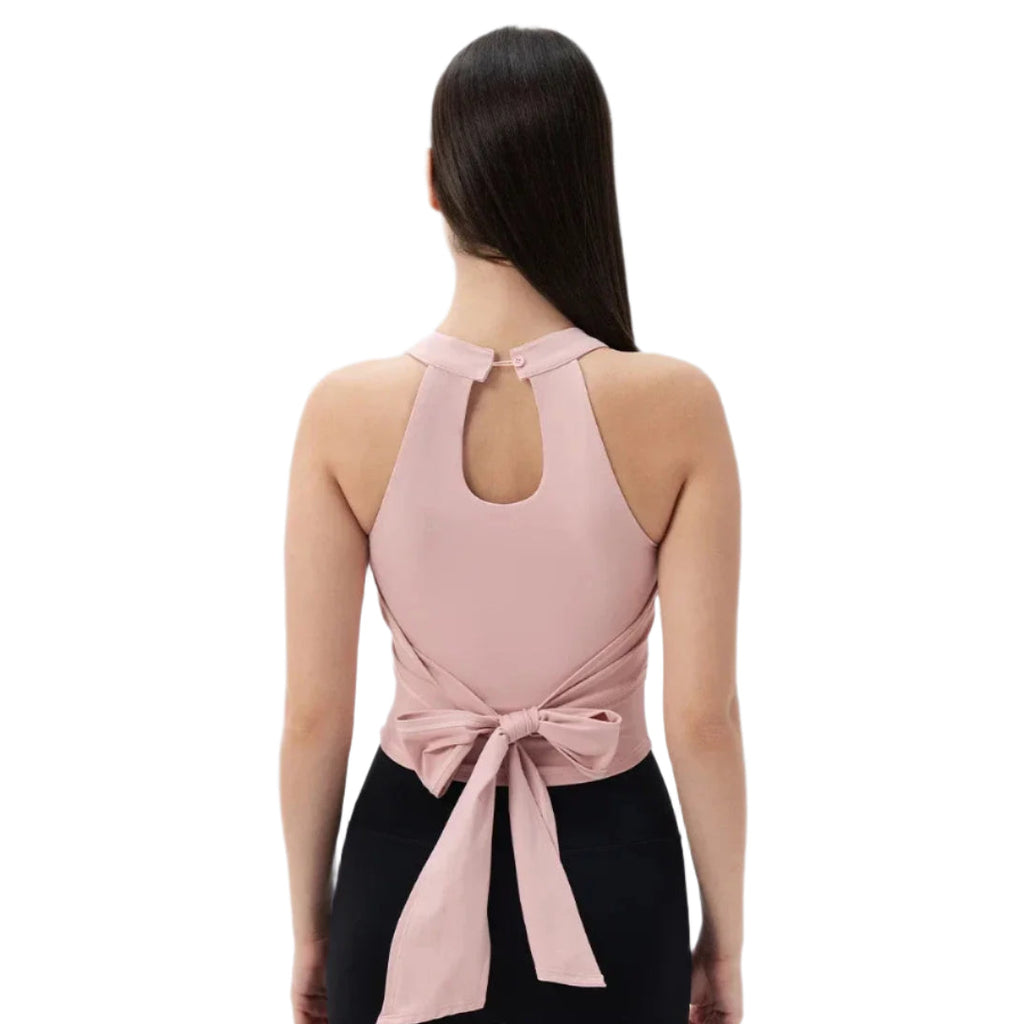 Back view of a pink Xooie Fit Fitted Workout Top for Women with a stylish tie detail