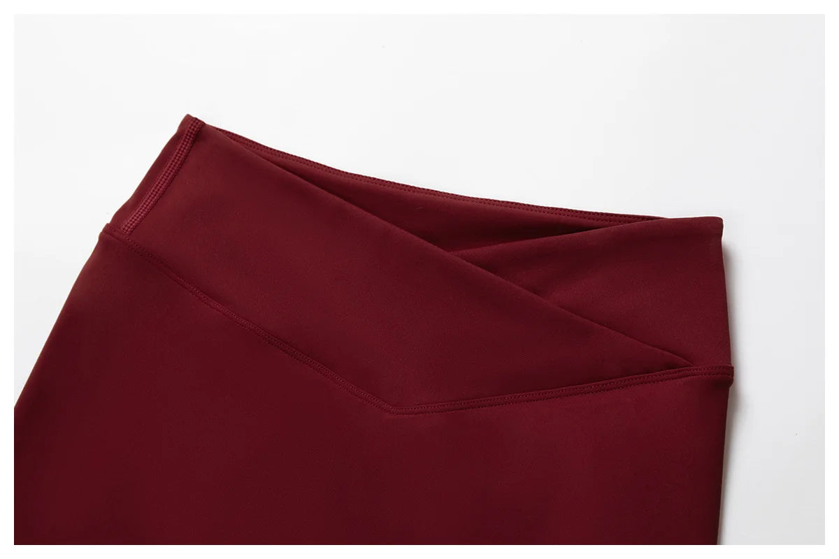 Close-up of burgundy Xooie Fit flare pants for a stylish flare pants and bra workout outfit