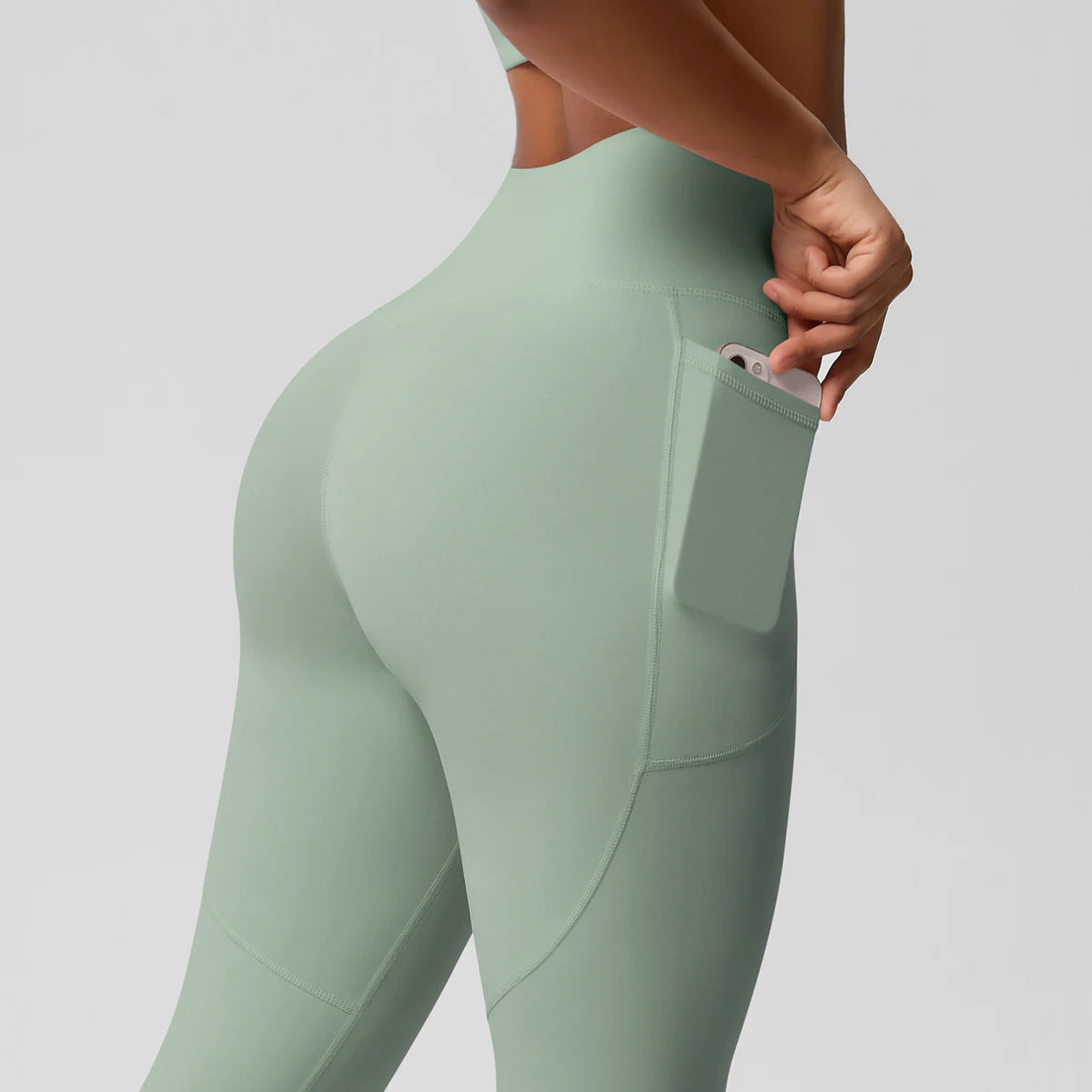 Xooie Fit high intensity pocket leggings in green with a side pocket for phone storage