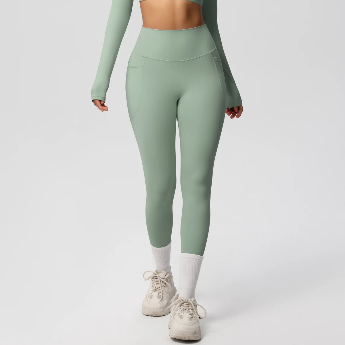 Xooie Fit high intensity pocket leggings in green for active workouts with secure pockets