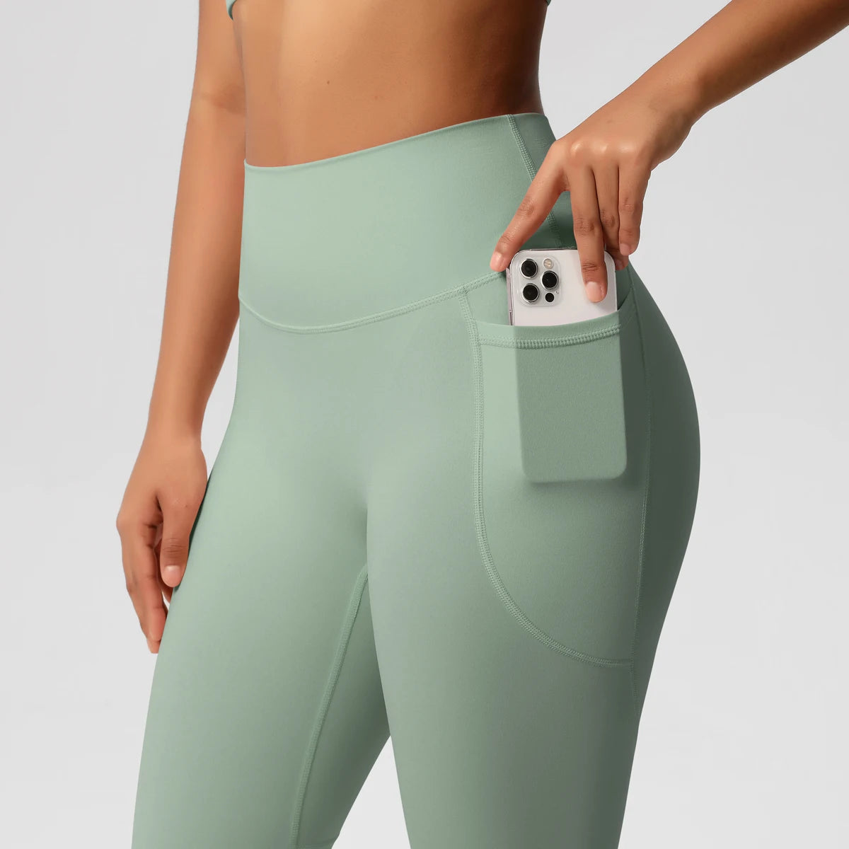 Light green high intensity pocket leggings from Xooie Fit with side phone pocket for convenience