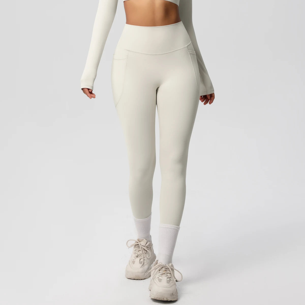 Xooie Fit high intensity pocket leggings in light color with a flattering high waistband