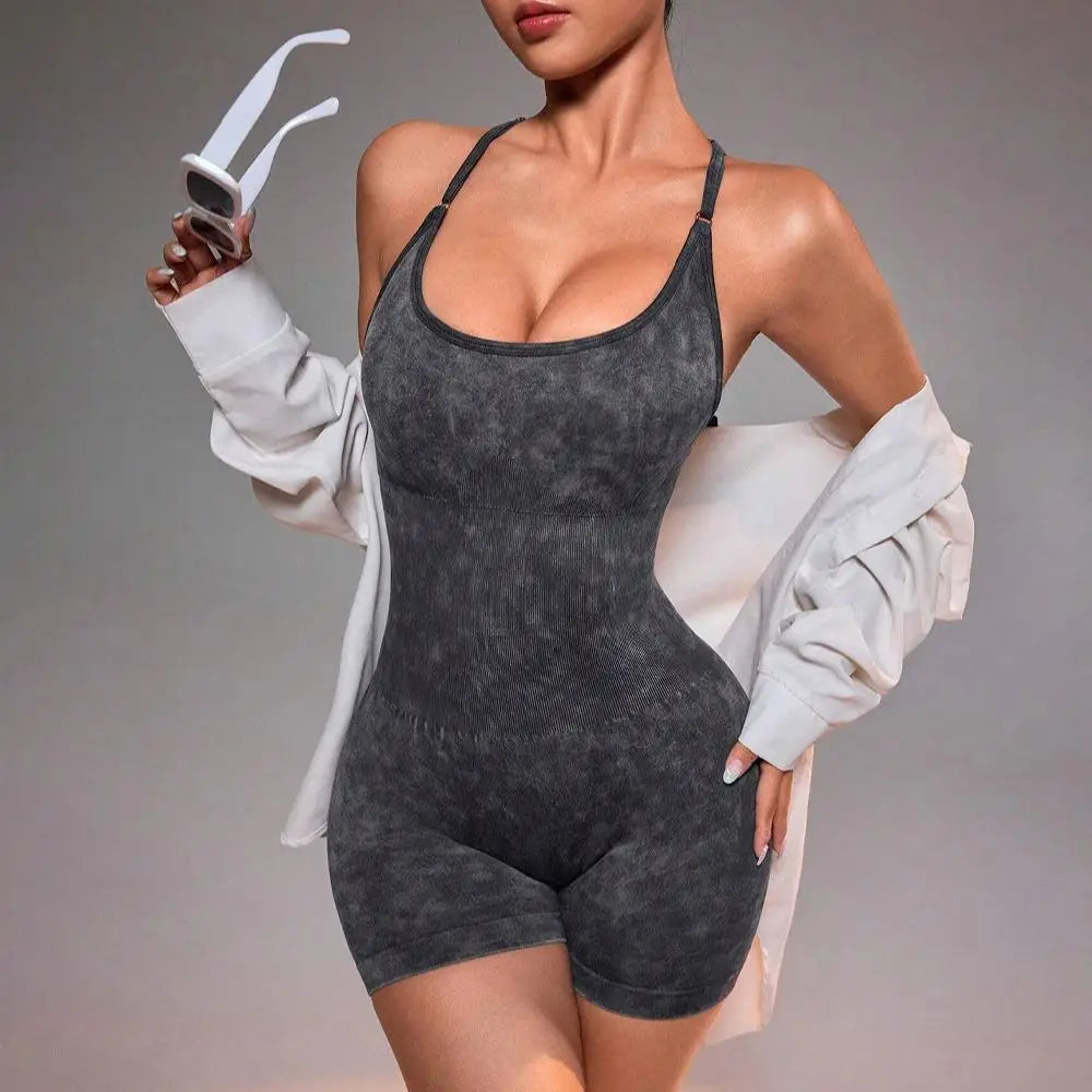 Washed black strappy yoga unitard romper with scoop neckline, seamless shorts