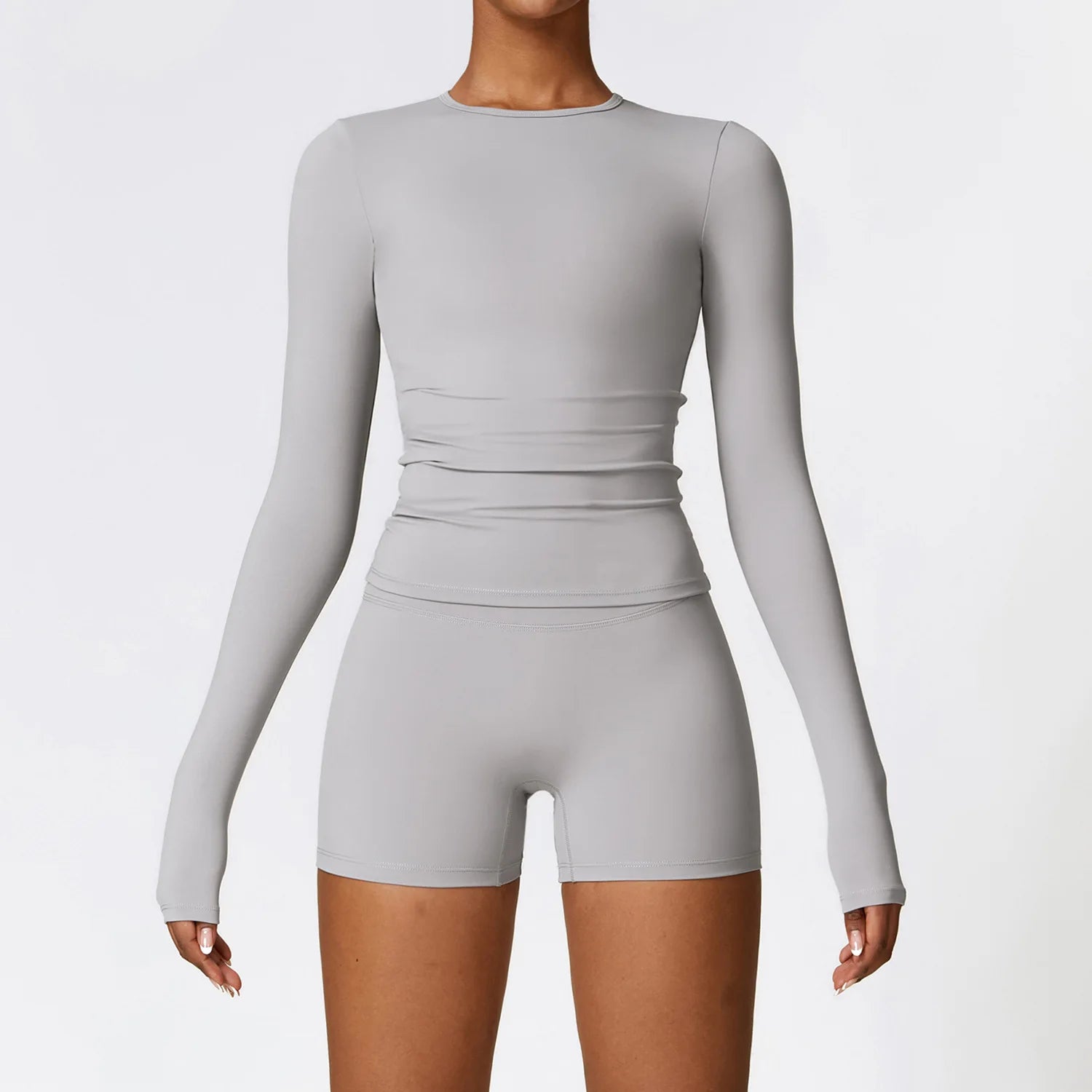 Xooie Fit Long Sleeve Workout Outfit in Gray, featuring a fitted top and matching shorts for activewear