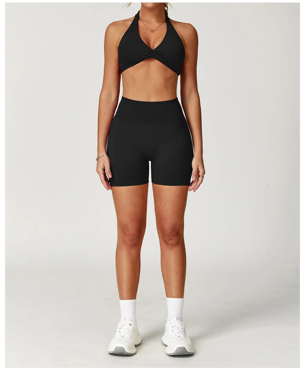 Xooie Fit two-piece set featuring a matching sports bra and shorts for gym workouts in black