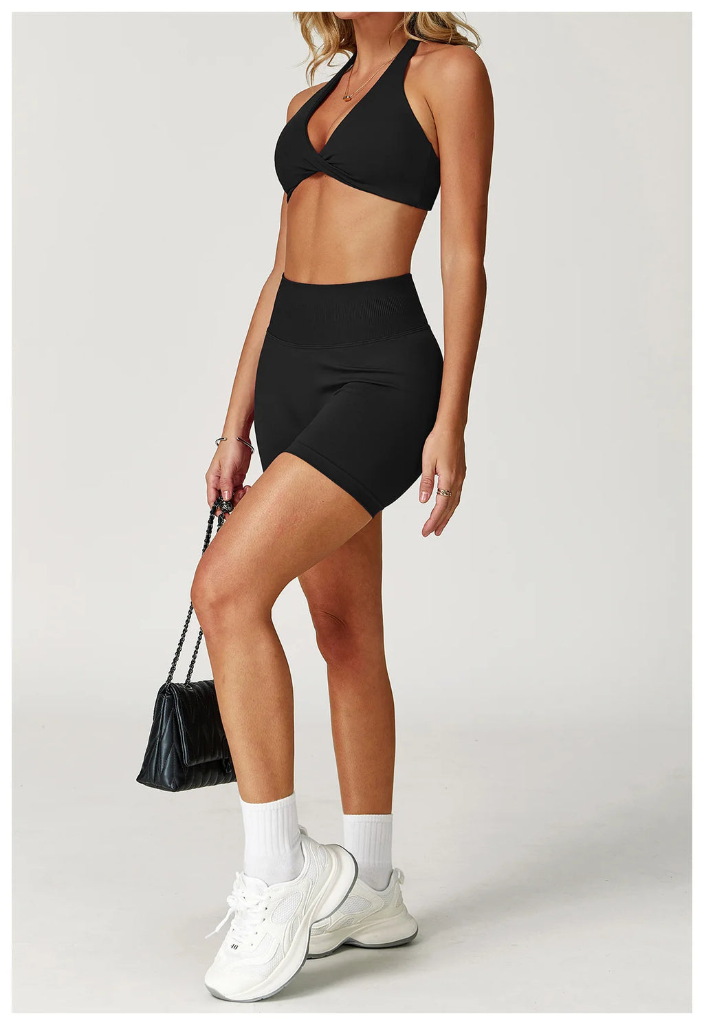 Xooie Fit matching sports bra and shorts for gym in black, ideal for workouts and fitness activities