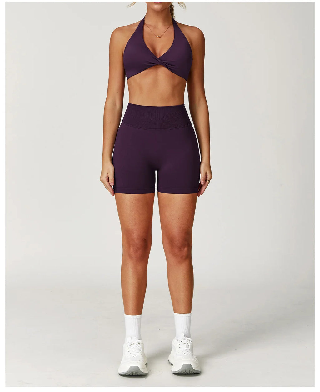 Xooie Fit Two-Piece Set featuring a matching sports bra and shorts for gym in deep purple color