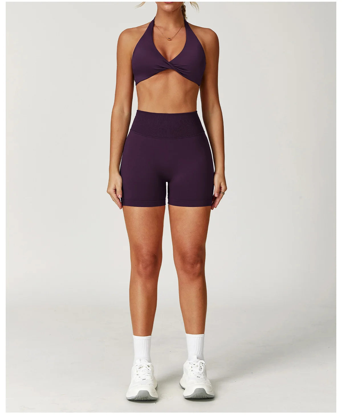 Xooie Fit Two-Piece Set featuring a matching sports bra and shorts for gym in deep purple color