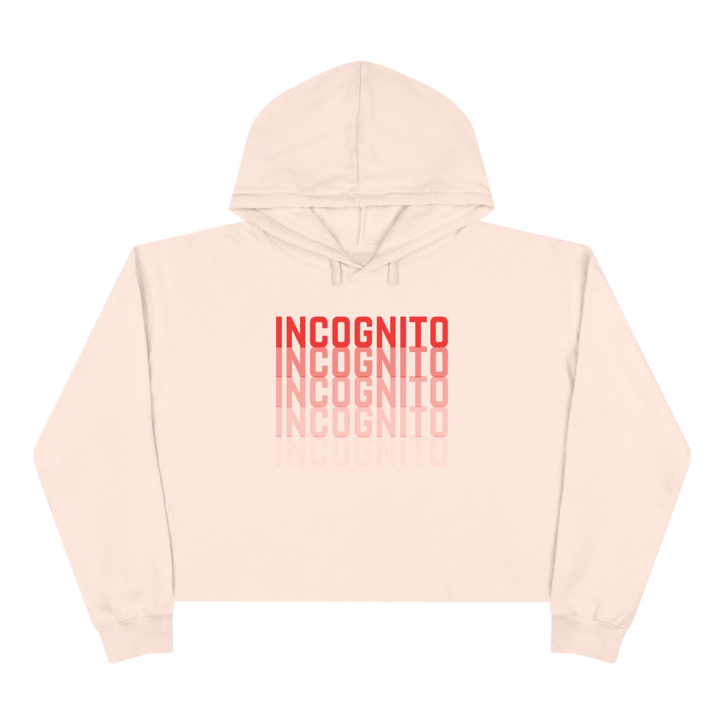 Light pink cropped hoodie with hood, drawstrings, and large back “INCognito” text print