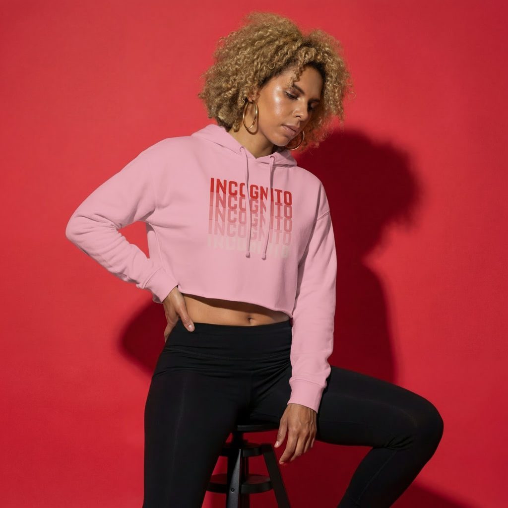 Light pink cropped active hoodie with hood and drawstrings, front “INCognito” graphic
