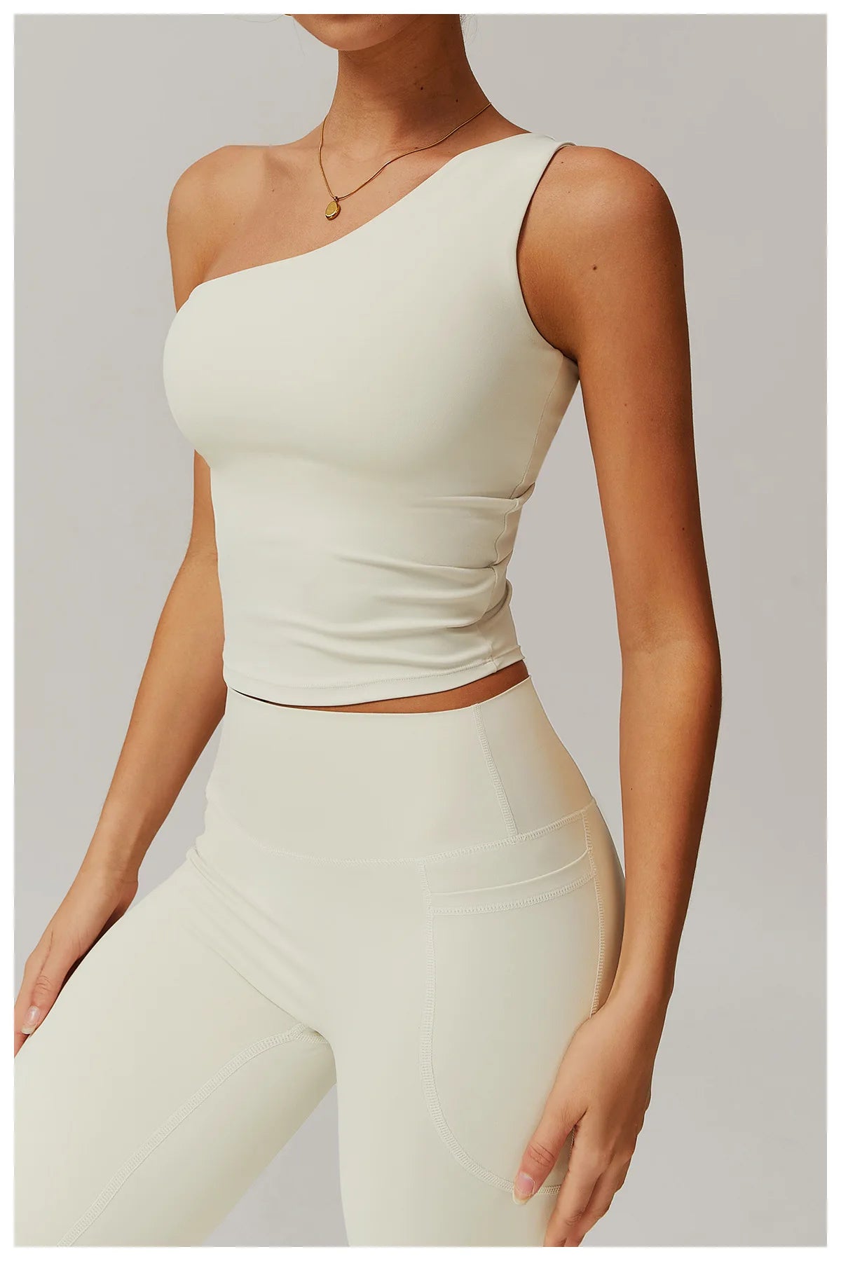 Xooie Fit One Shoulder Workout Top in Cream Color for Stylish Fitness Enthusiasts