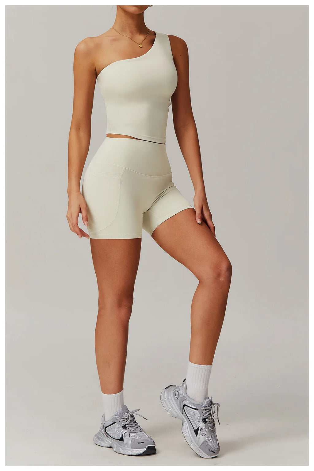 Xooie Fit one shoulder workout top in light beige, ideal for stylish gym sessions and active wear