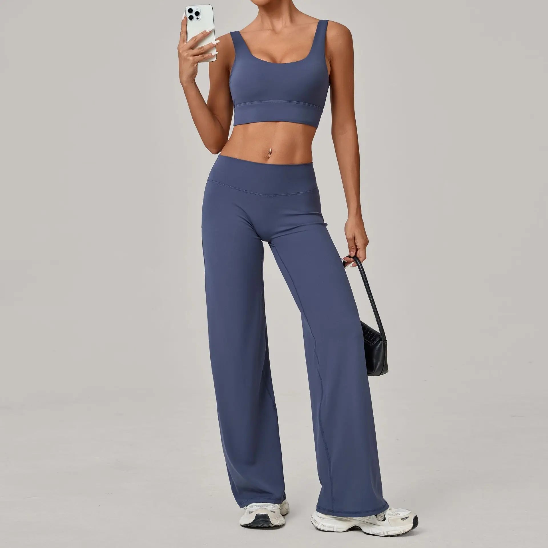 Xooie Fit open back crop top and flare pants set in stylish blue for a trendy look