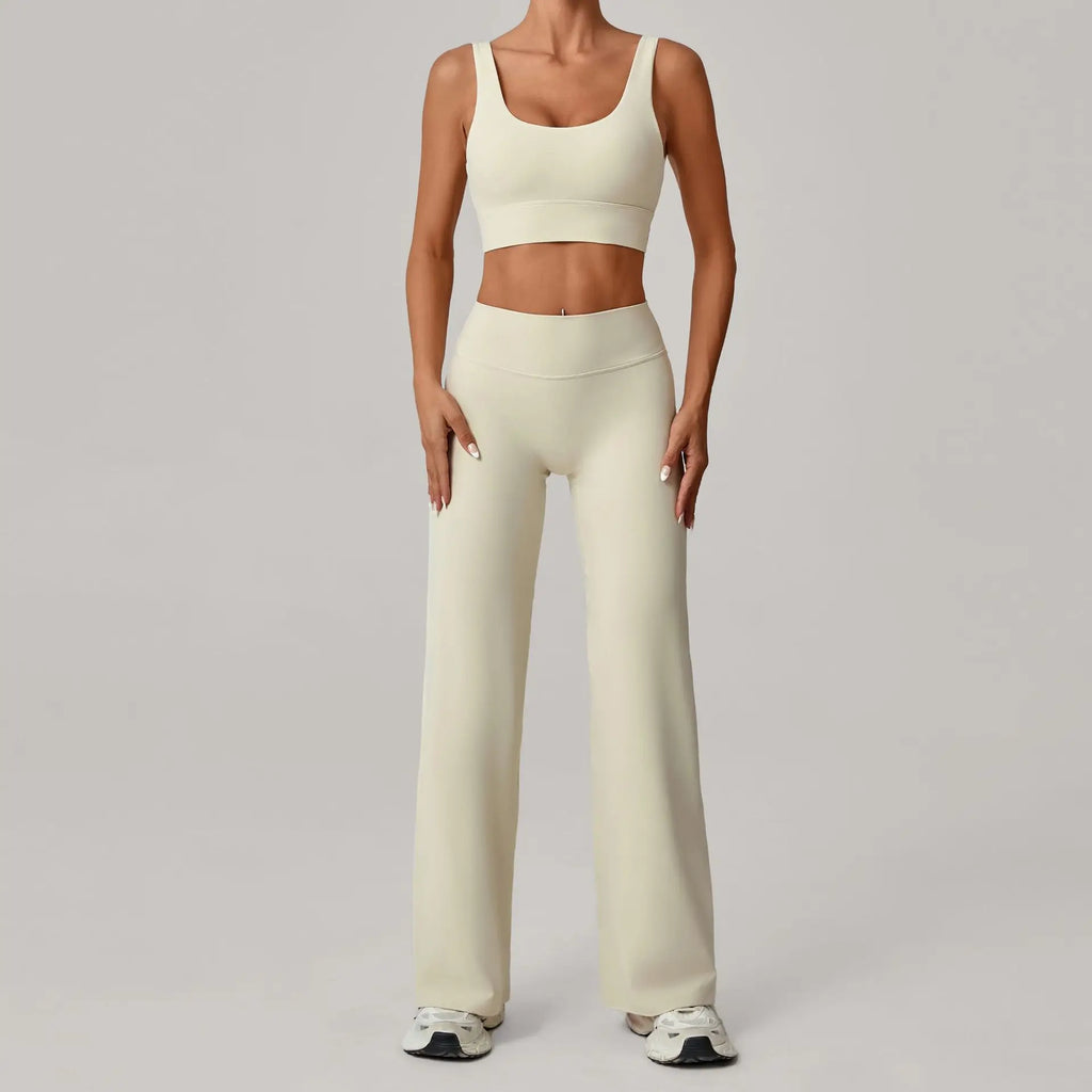 Xooie Fit open back crop top and flare pants set in light color, perfect for casual wear and workouts