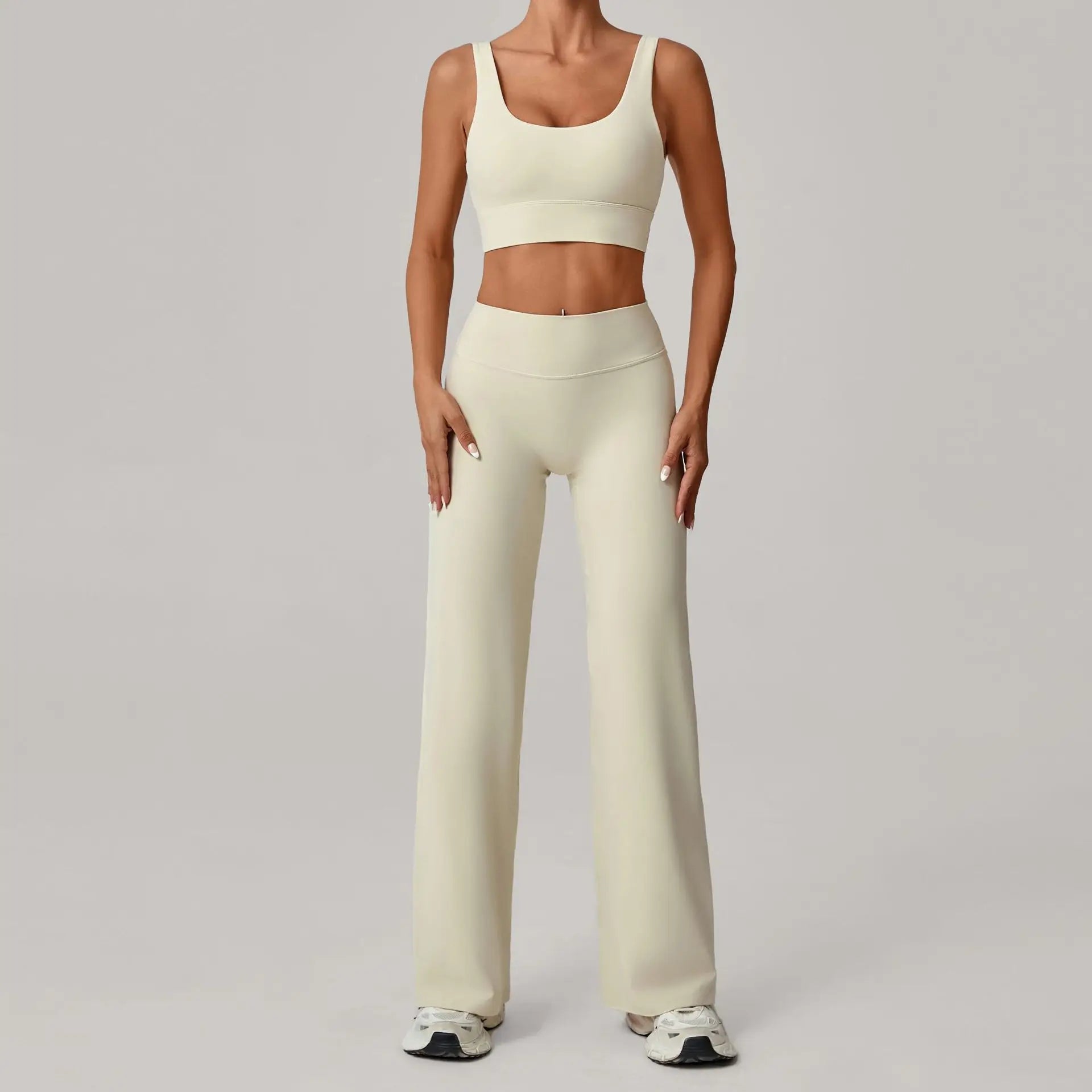 Xooie Fit open back crop top and flare pants set in light color, perfect for casual wear and workouts