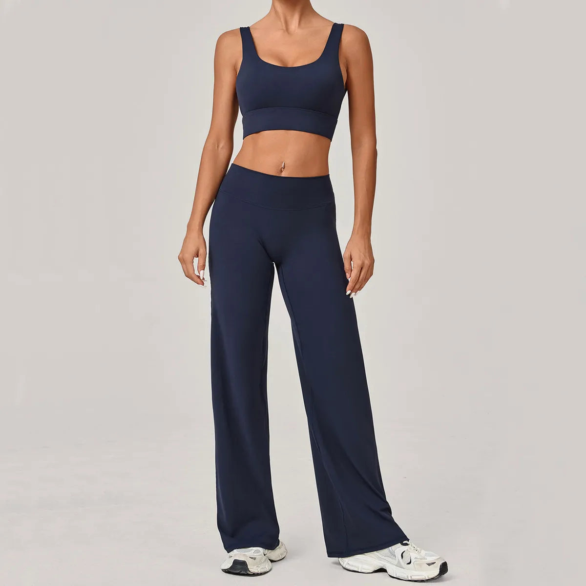 Stylish navy open back crop top and flare pants set by Xooie Fit for comfortable casual wear