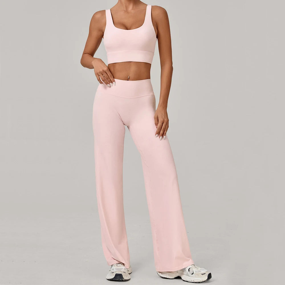 Xooie Fit open back crop top and flare pants set in soft pink for a trendy and comfortable look