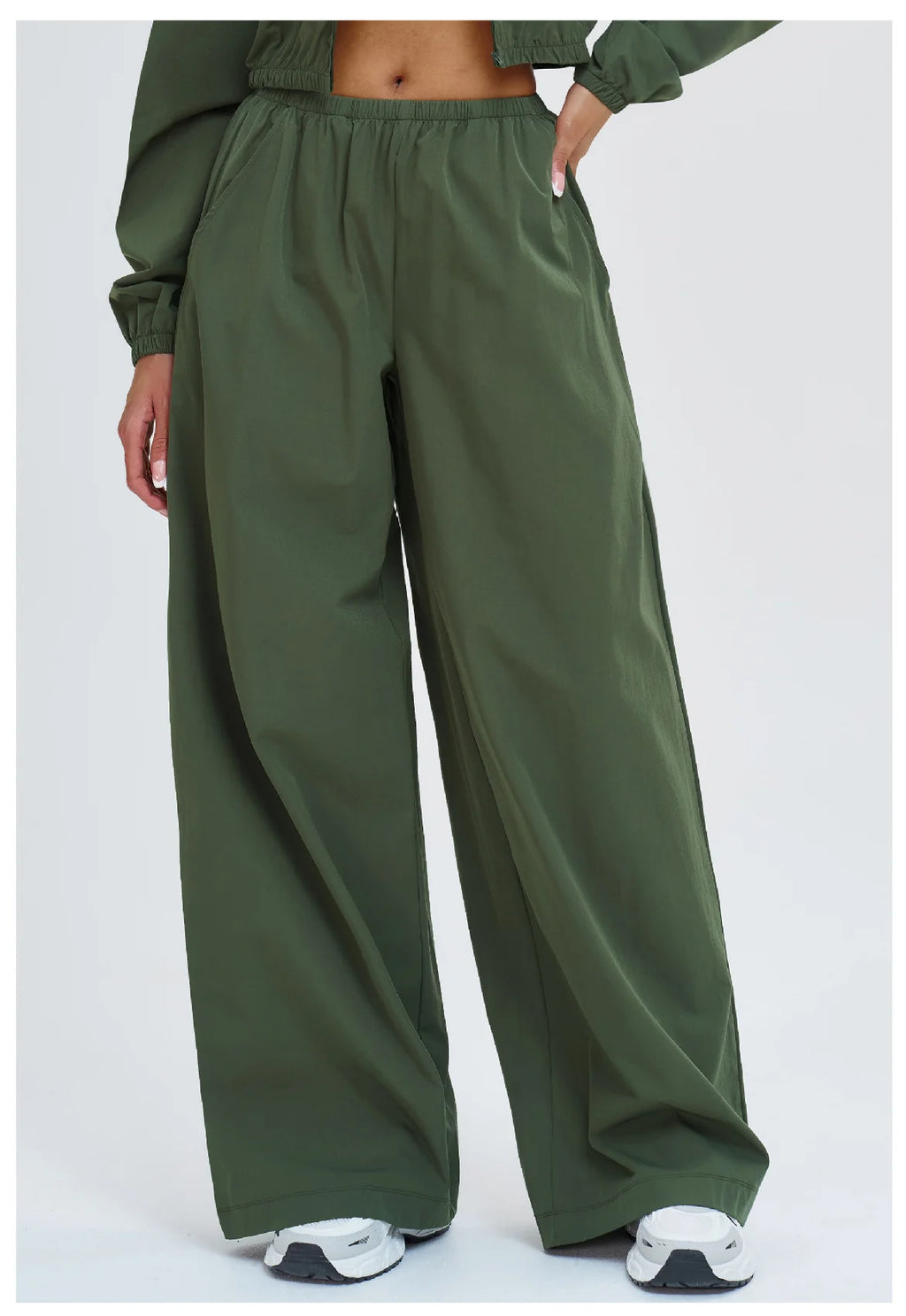 Dark green wide-leg yoga pants with elastic waistband and side pockets