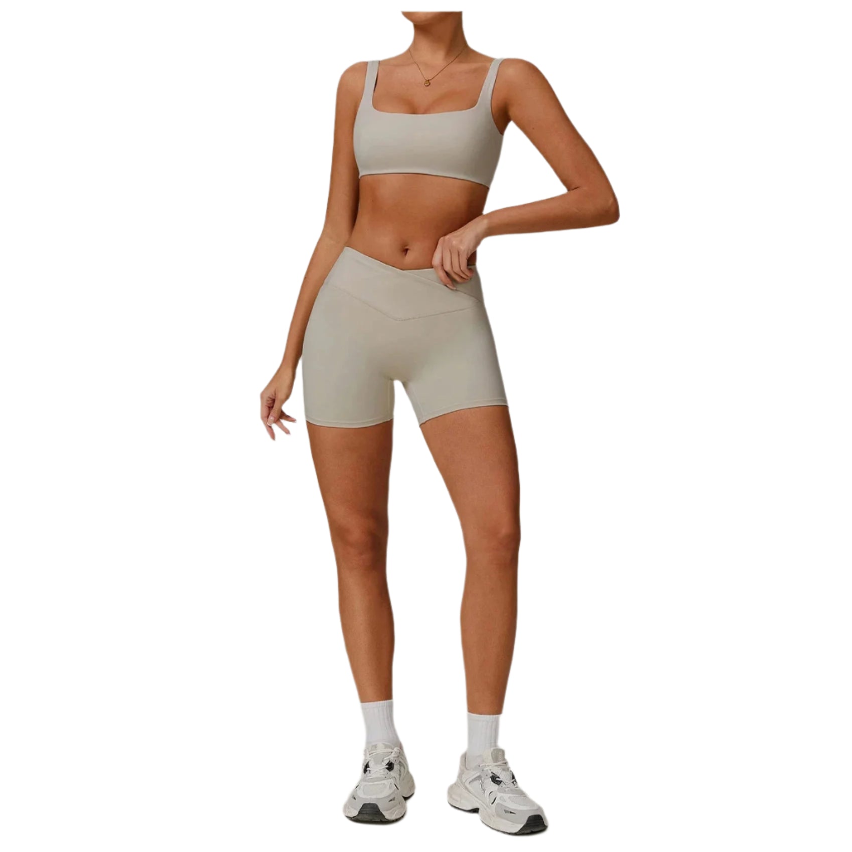 Xooie Fit Two-Piece Set featuring a comfortable sports bra and shorts set in light beige for active wear