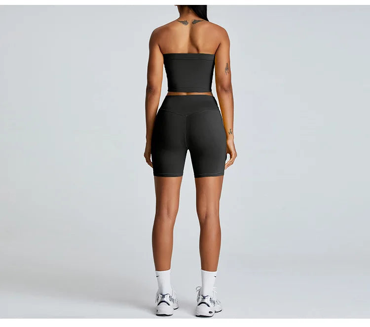 Xooie Fit strapless activewear set in black featuring a cropped top and high-waisted shorts