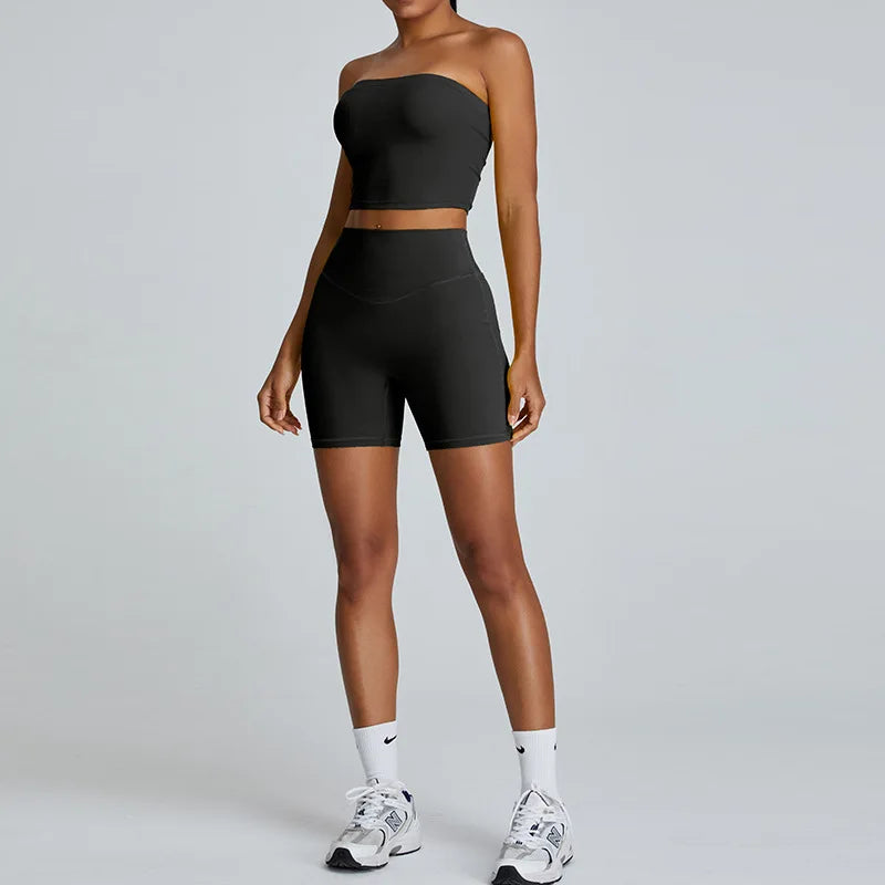 Xooie Fit strapless activewear set in black featuring a crop top and shorts for comfortable workouts