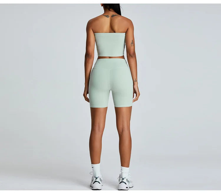 Xooie Fit strapless activewear set in light green, featuring a crop top and high-waisted shorts