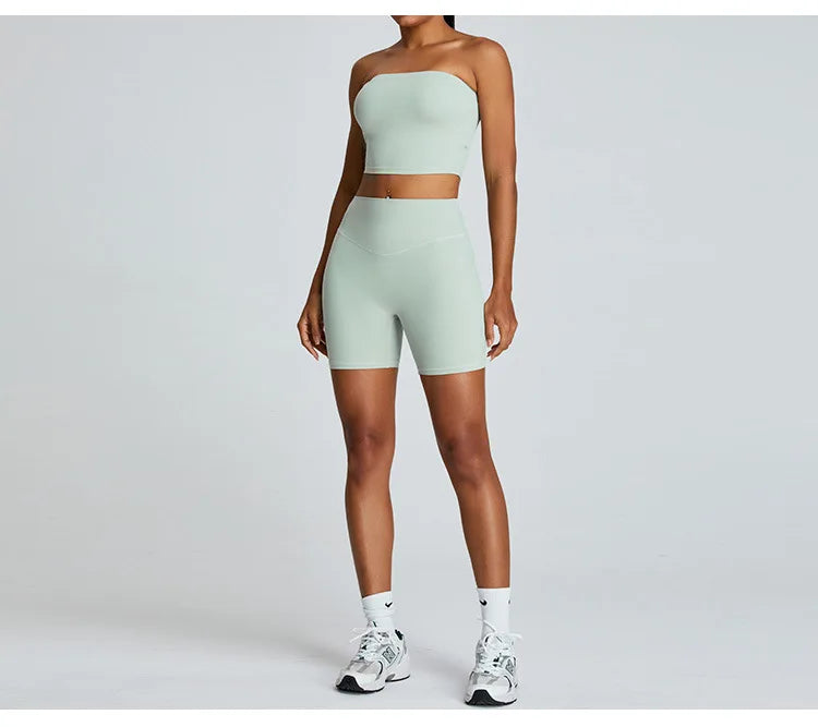 Xooie Fit strapless activewear set in light green featuring a strapless top and high-waisted shorts