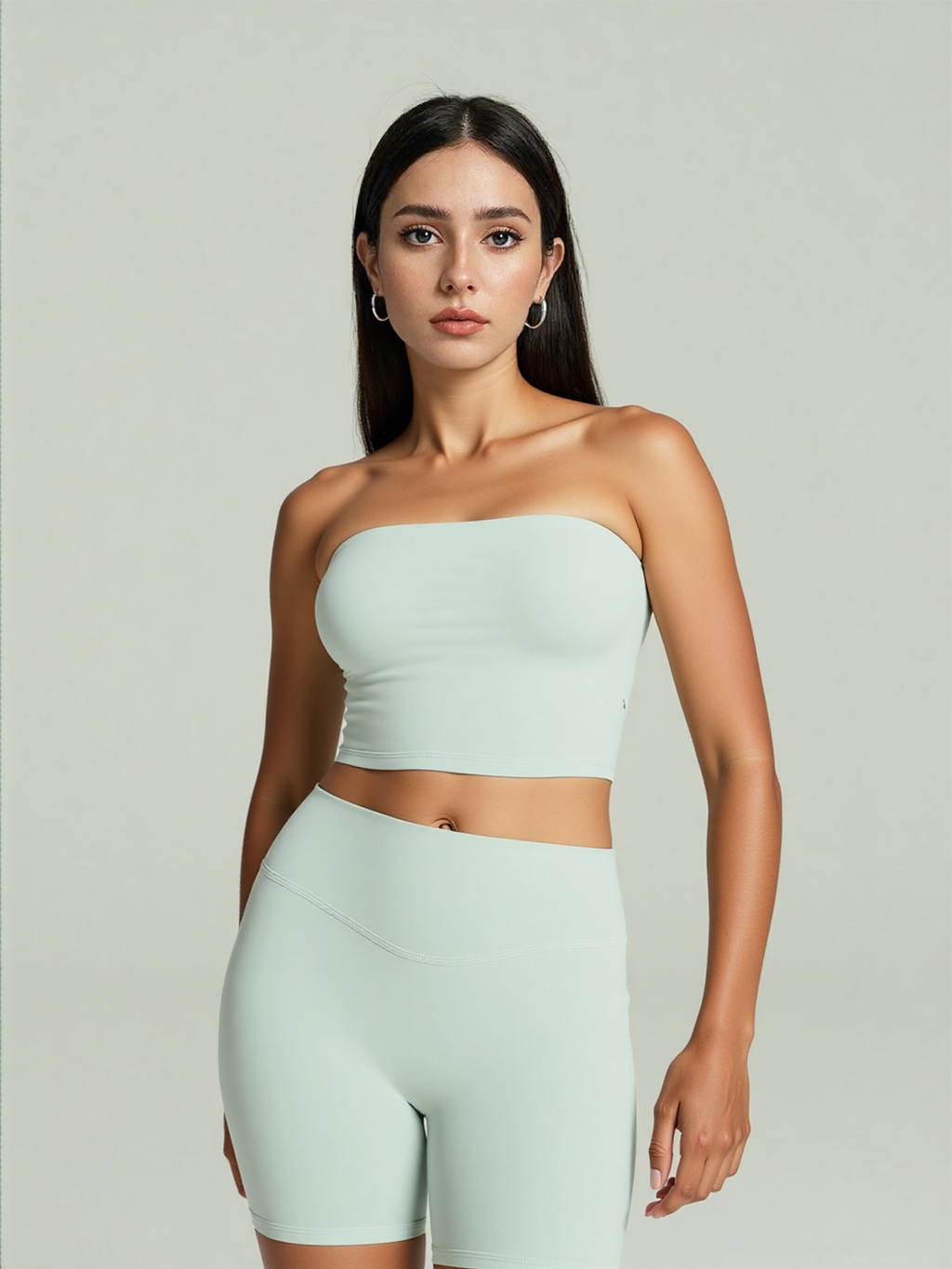 Xooie Fit strapless activewear set in light green featuring a fitted crop top and high-waisted shorts.
