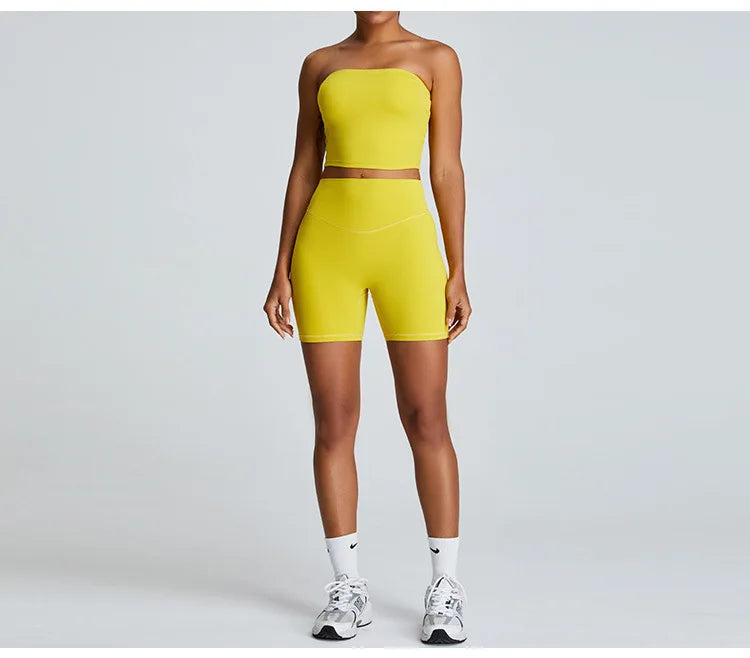 Yellow strapless activewear set by Xooie Fit featuring a crop top and fitted shorts