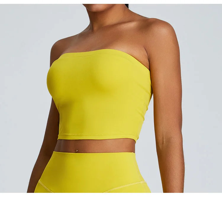 Bright yellow strapless activewear set featuring a cropped top and matching high-waisted leggings