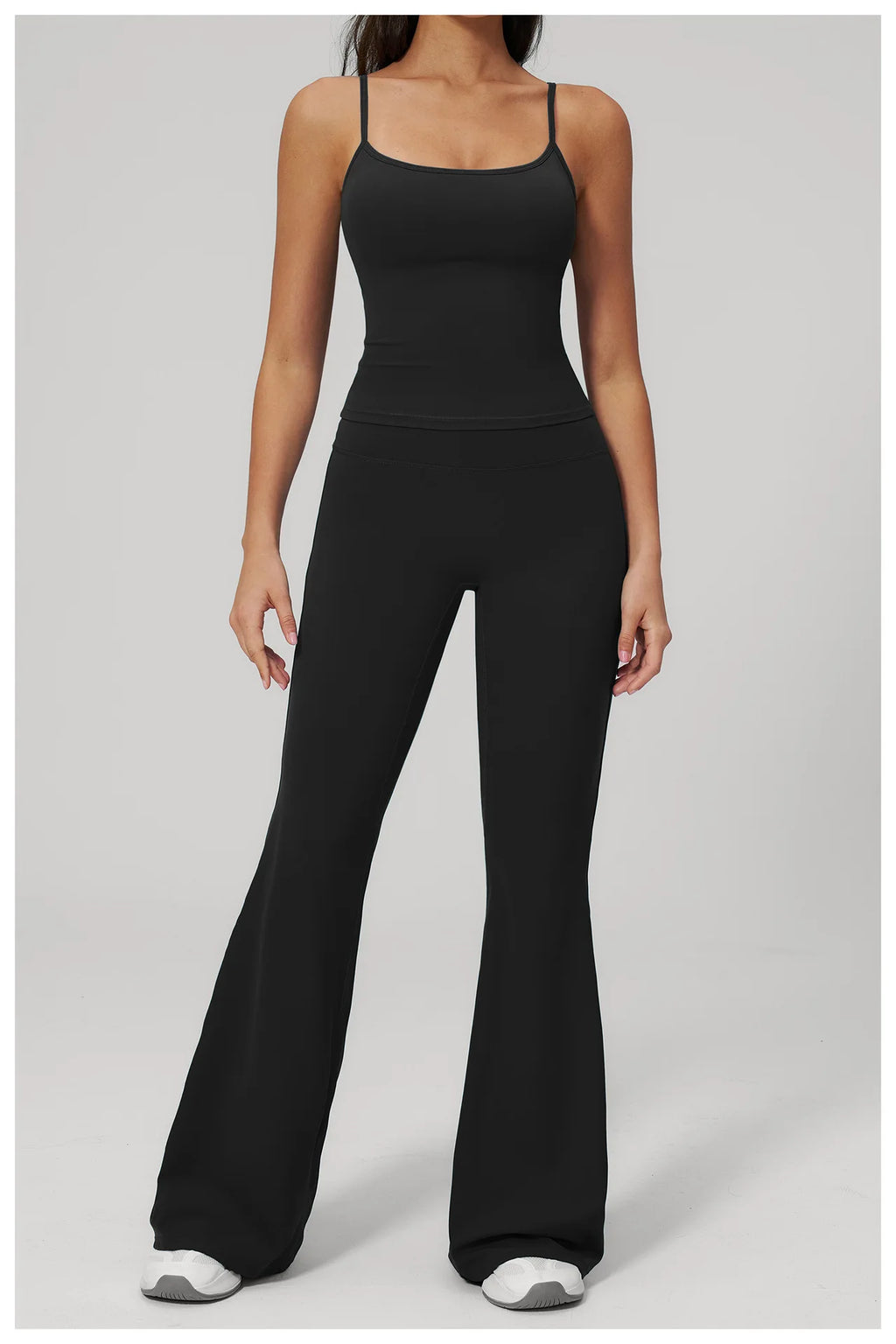 Women’s black sports set with front view: tank top and flared leggings