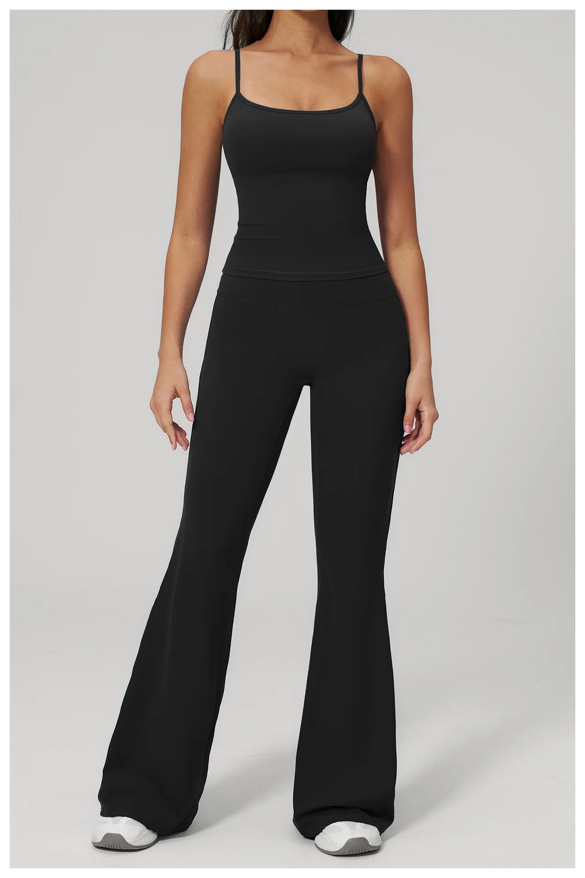Women’s black sports set with front view: tank top and flared leggings