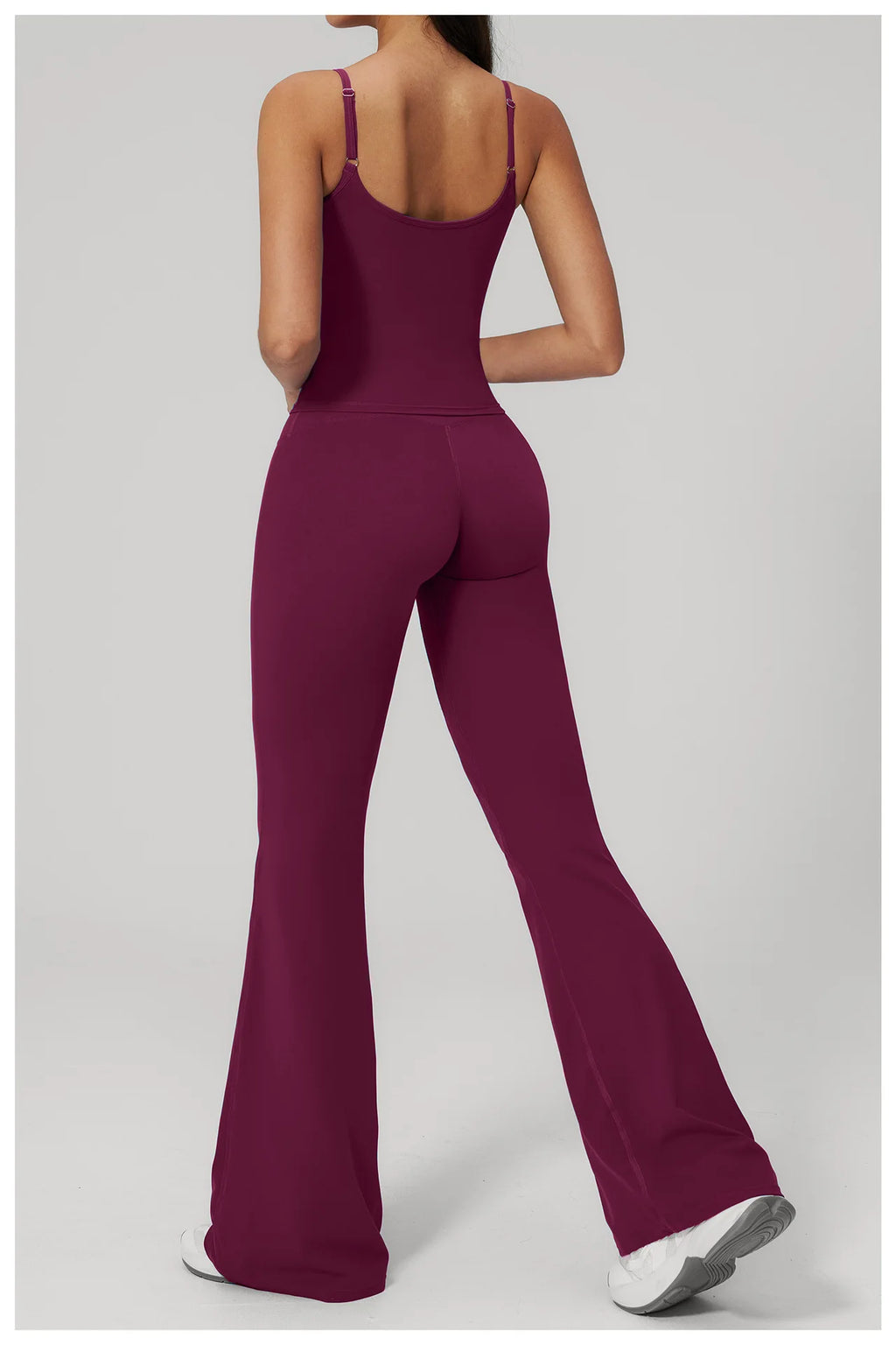 Women's purple sports set, back view: racerback tank and flared leggings