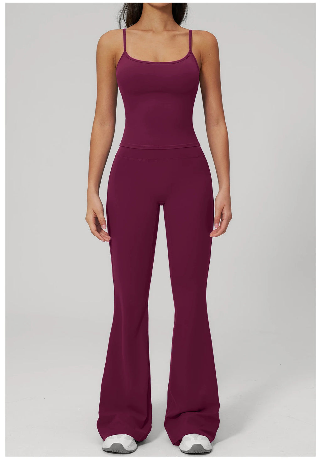 Women's purple sports set, front view: tank top and flared leggings with built-in bra
