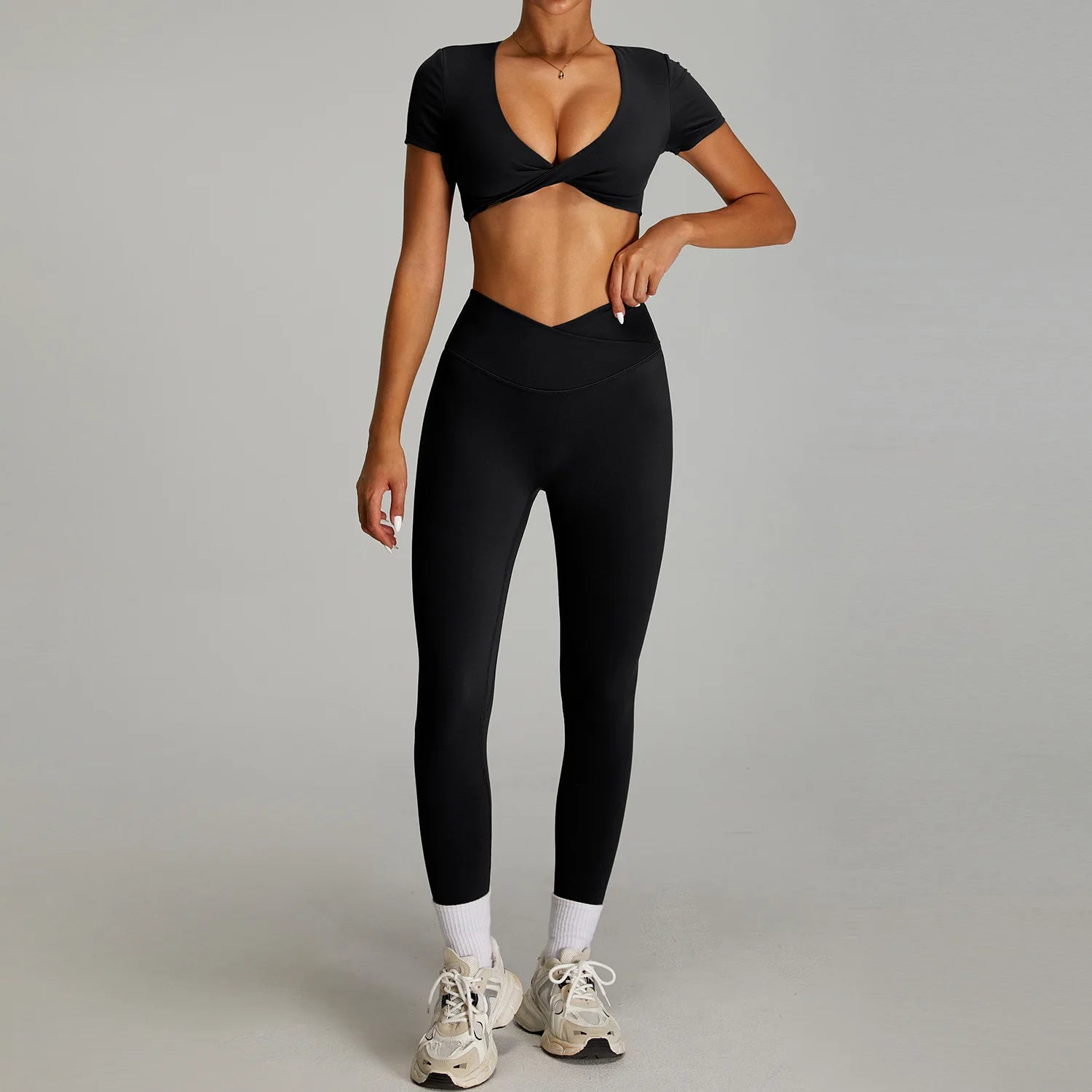 Xooie Fit twist crop top and leggings outfit in black, perfect for activewear and stylish workouts.