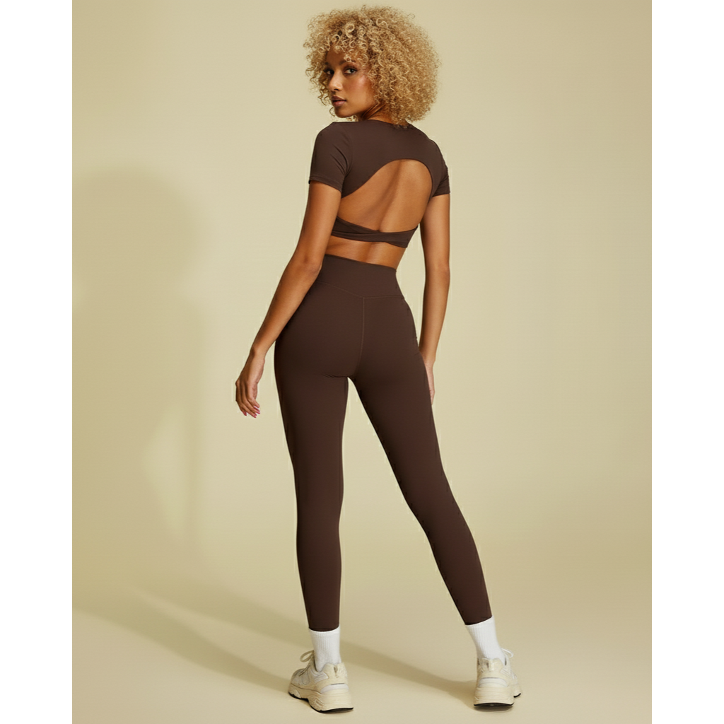 Xooie Fit twist crop top and leggings outfit in brown, featuring a stylish open back design