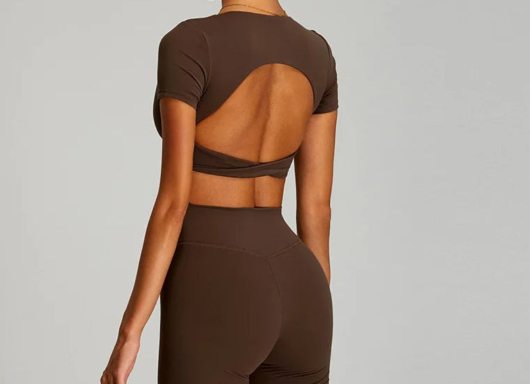 Stylish twist crop top and leggings outfit in brown from Xooie Fit with a unique open back design