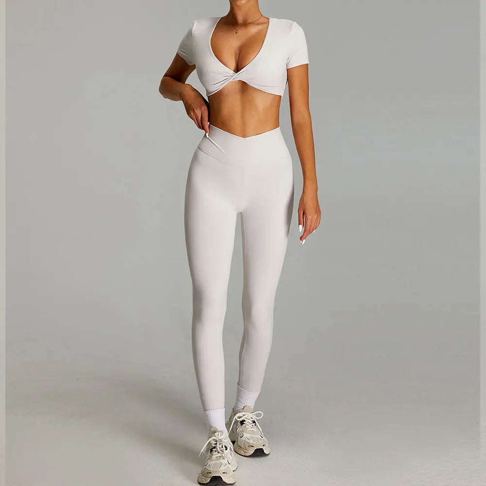 Xooie Fit Twist crop top and leggings outfit in light beige for stylish workouts