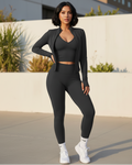 Black matching set: halter tank, fitted leggings, zip jacket with thumb holes