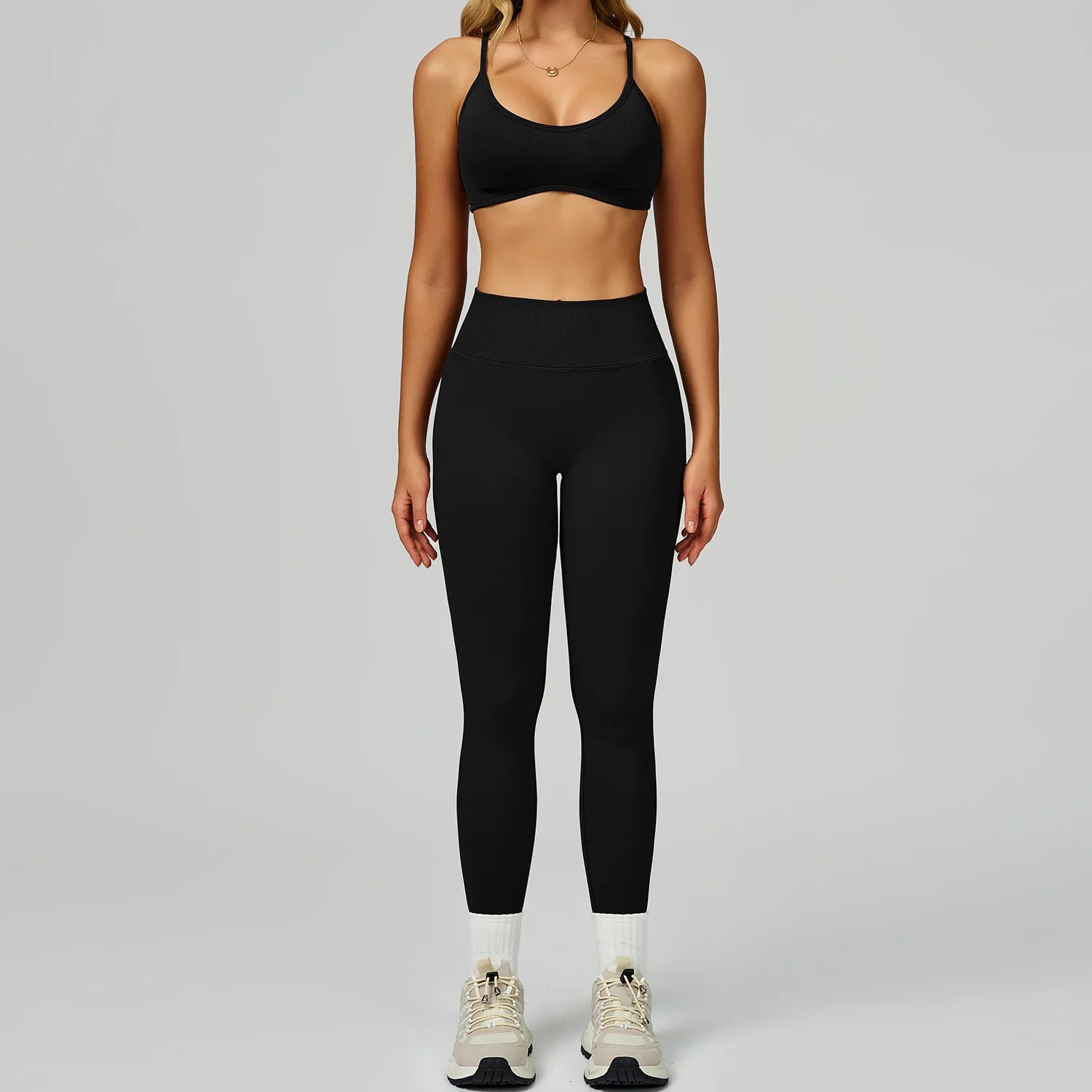 Xooie Fit women's activewear set featuring a black sports bra and high-waisted leggings for comfort during workouts