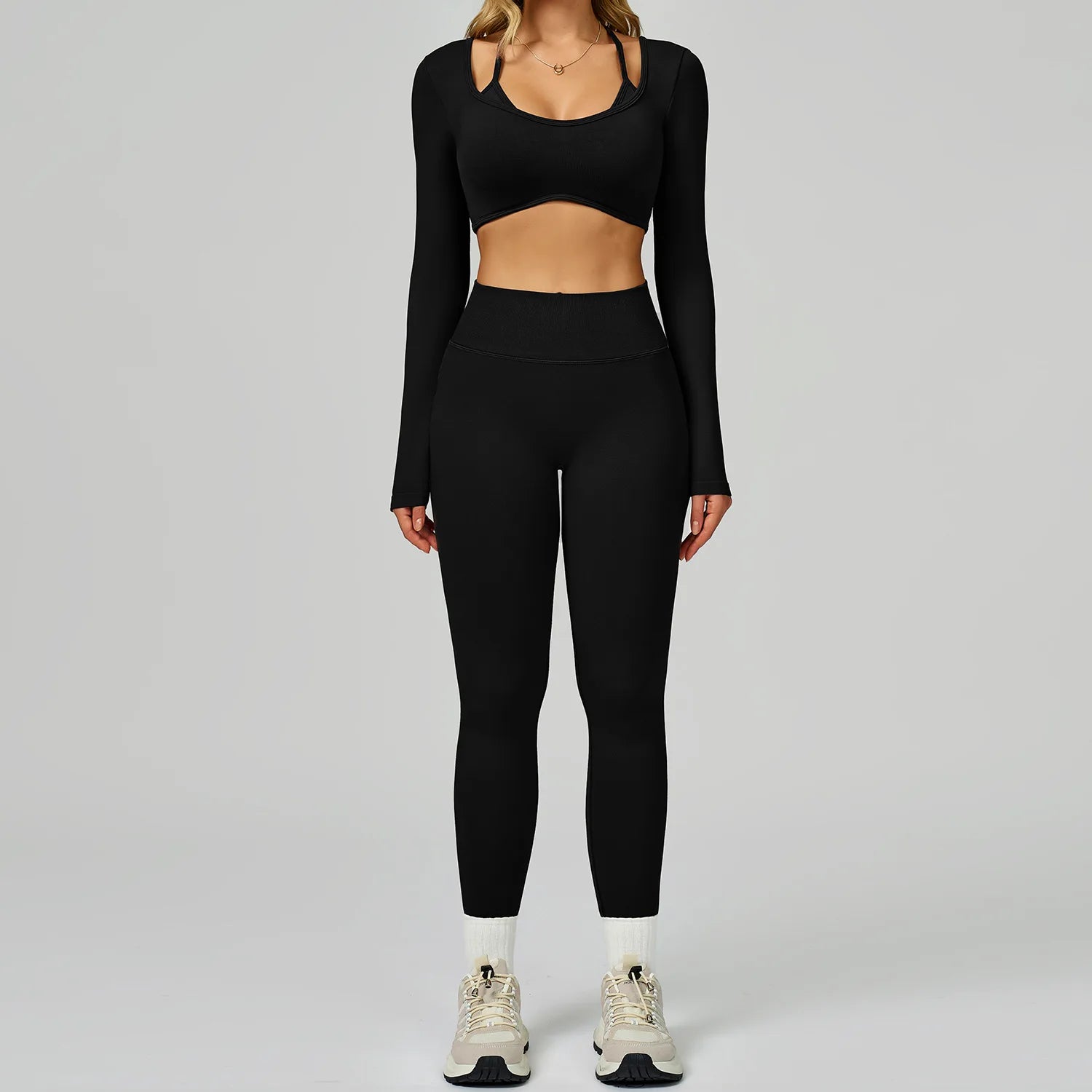 Xooie Fit women's activewear set featuring a long sleeve crop top and high-waist leggings in black