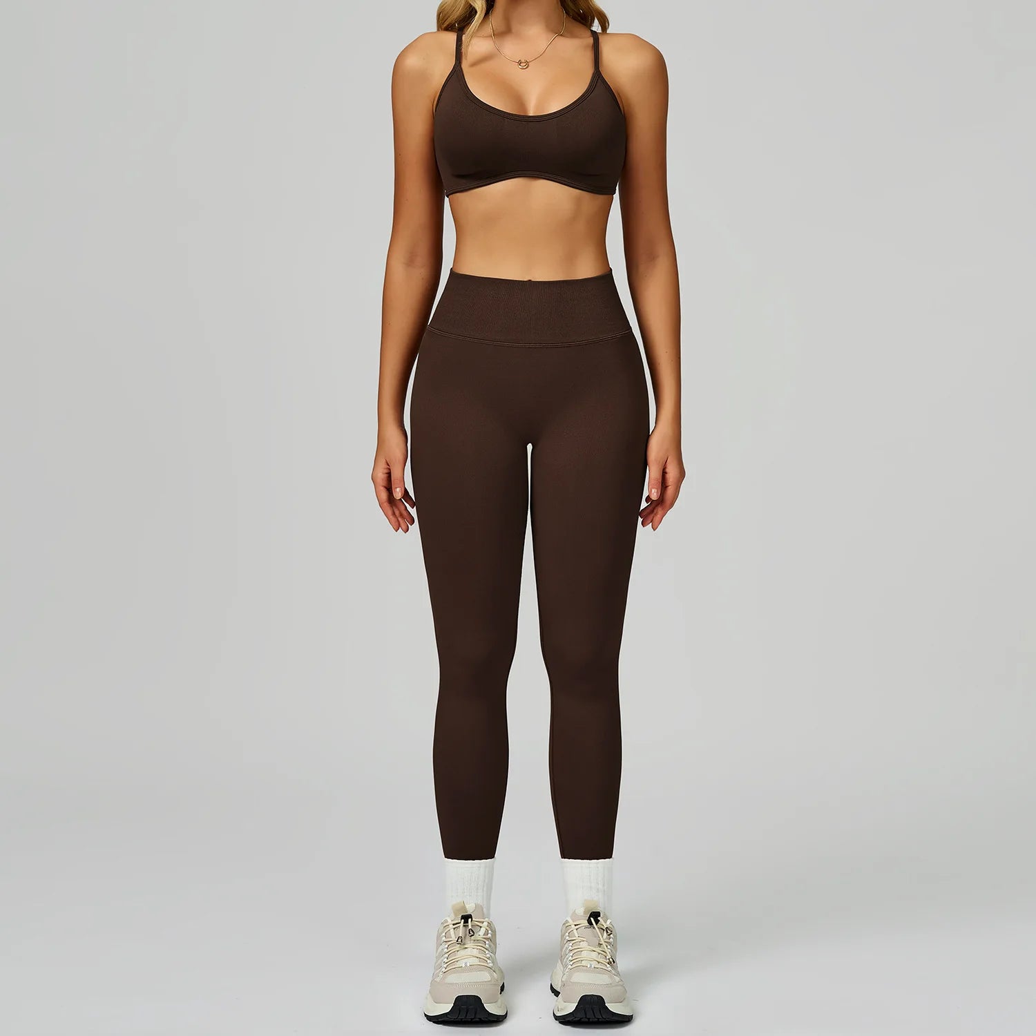 Xooie Fit women's activewear set featuring a brown sports bra and matching high-waisted leggings