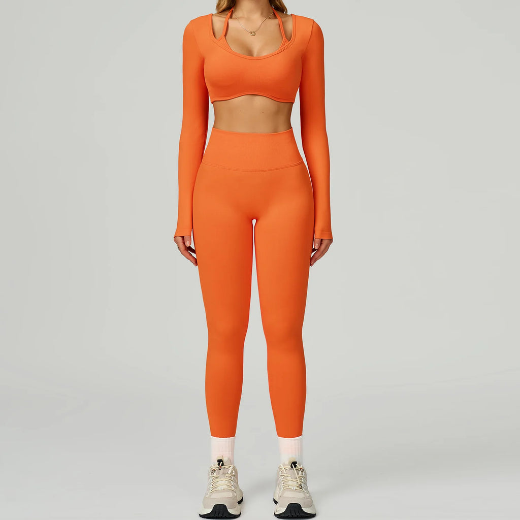 Xooie Fit women's activewear set in vibrant orange featuring a crop top and high-waisted leggings