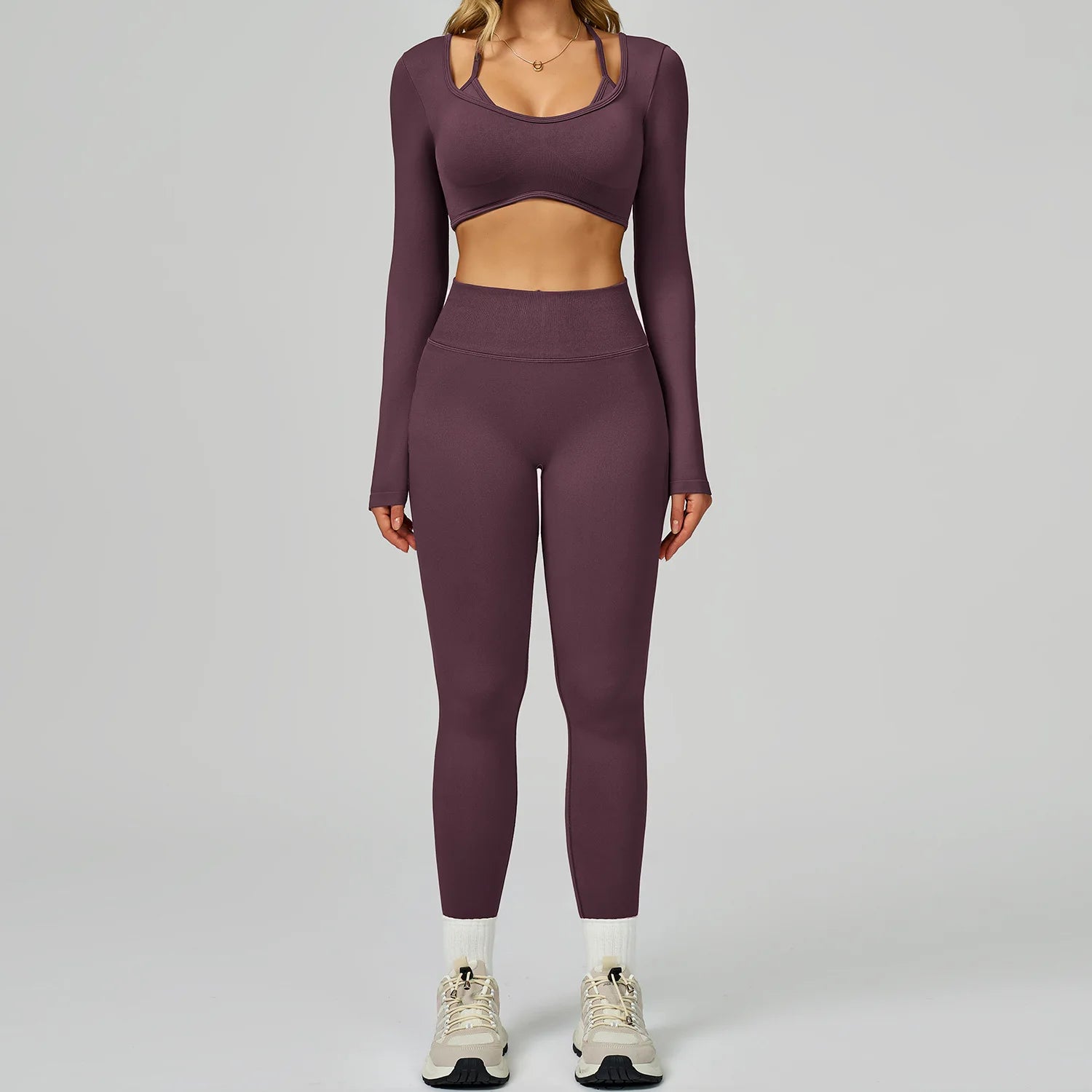 Xooie Fit women's activewear set in deep purple featuring long sleeves and leggings for workouts