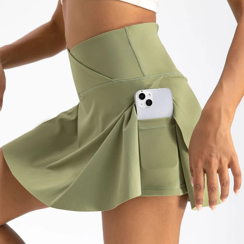 Xooie Fit women's athletic skort in green with side pocket for convenience during workouts