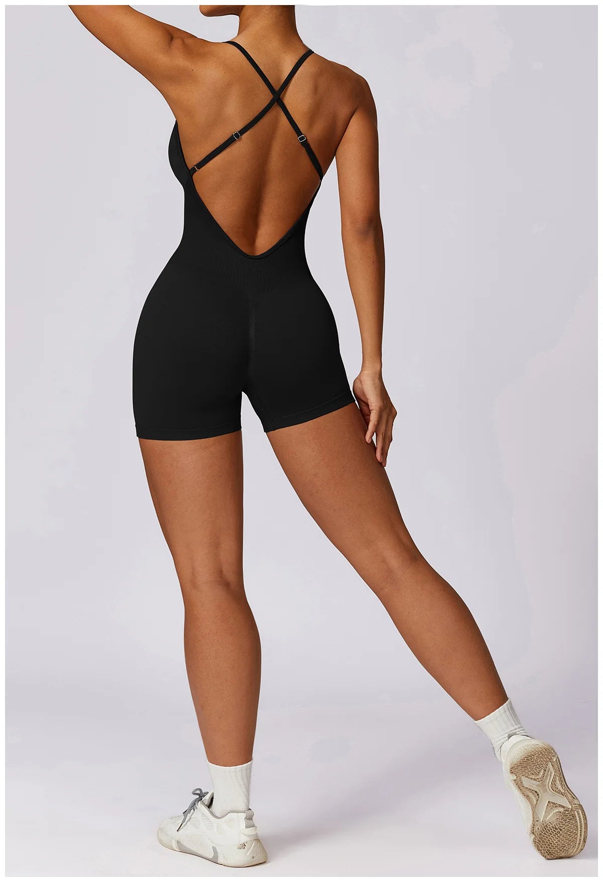 Xooie Fit women's fitness one-piece in black with stylish cross-back design for optimal comfort
