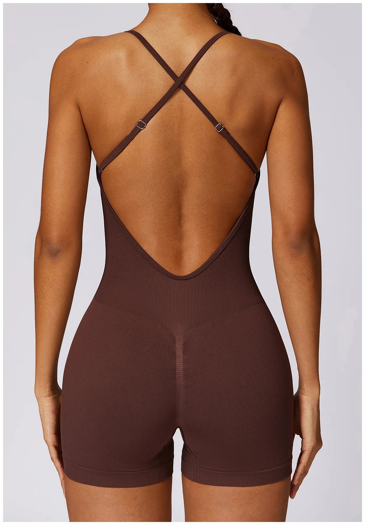 Xooie Fit women's fitness one-piece with criss-cross straps and a flattering back design